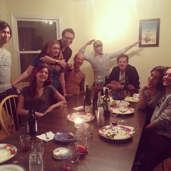 a group of people sitting around a table