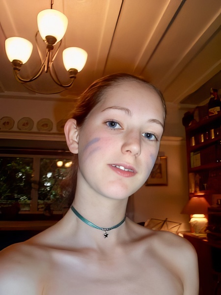 a woman with a necklace on her neck