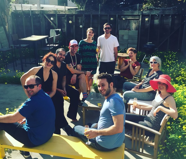 a group of people sitting on a bench