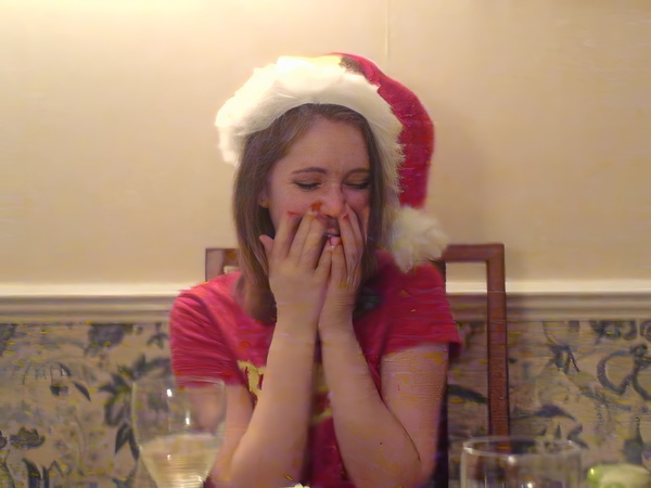 a girl wearing a santa hat