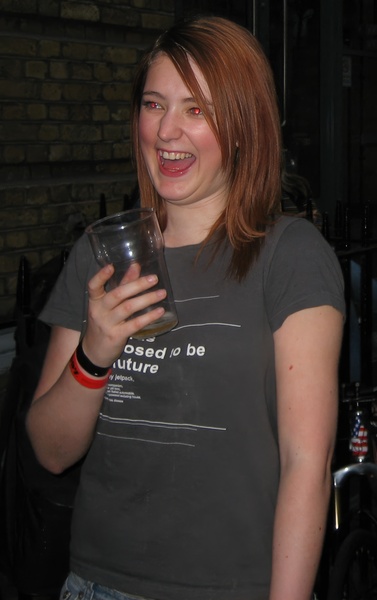 a woman holding a glass