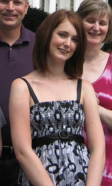 a woman wearing a black and white dress