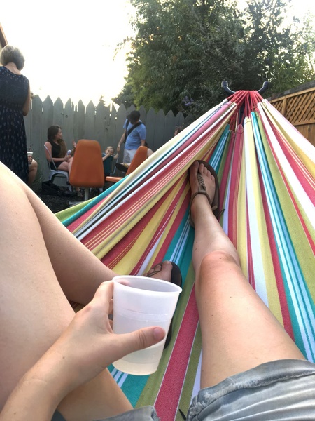 a person laying in a hammock on a hammock