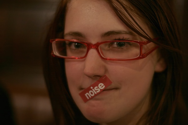 a woman with a red nose and glasses