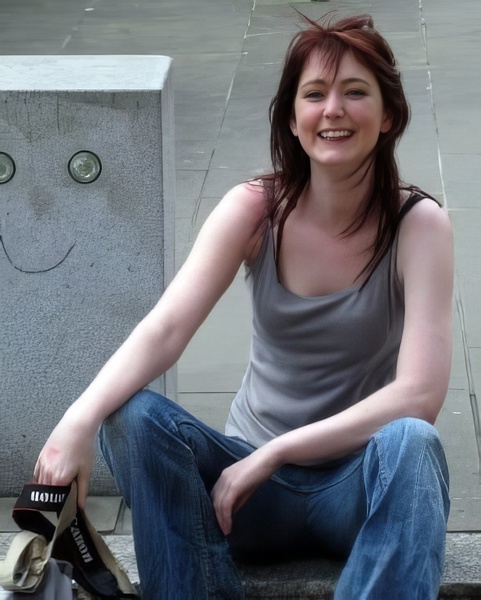 a woman sitting on a curb