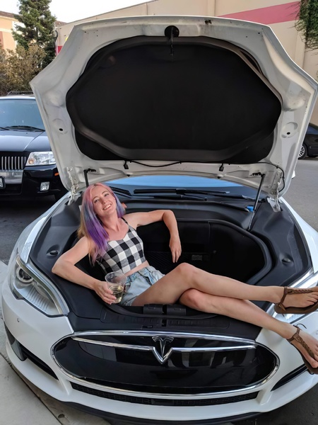 a woman sitting in the trunk of a car