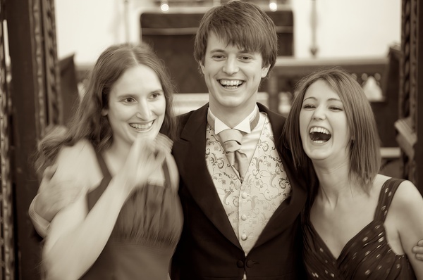 three young people are posing for a picture