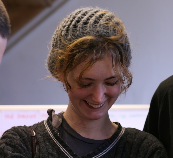 a woman with a hat on