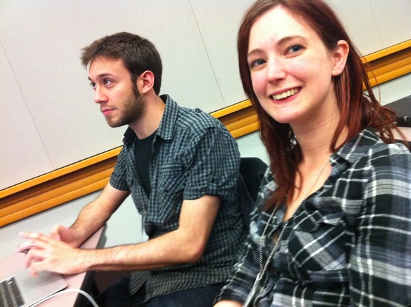 a man and a woman sitting next to each other people