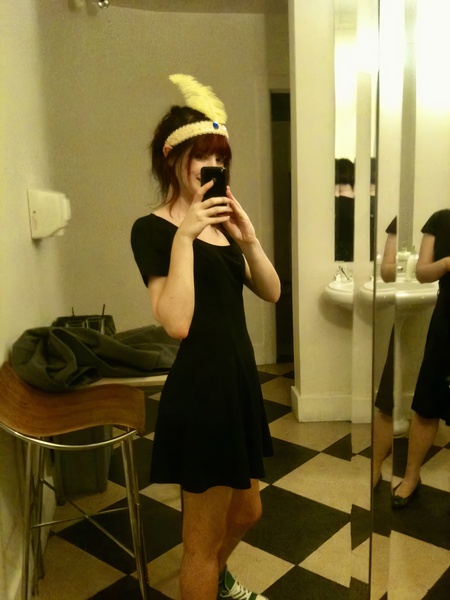 a woman in a black dress ae