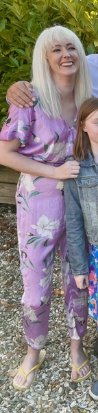 a woman and a child are posing for a picture