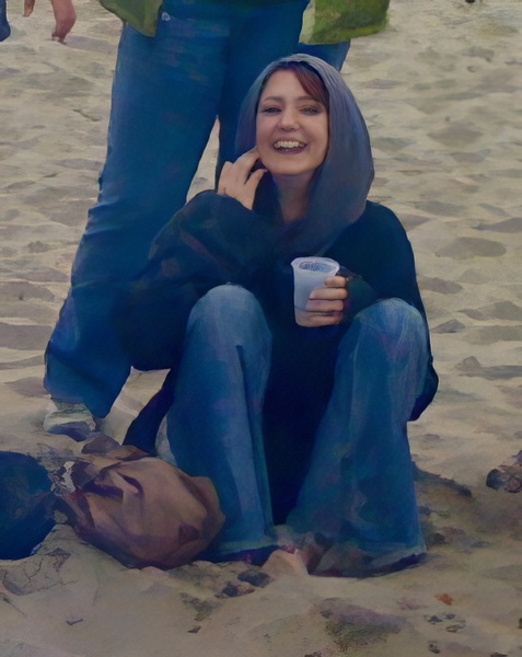 a woman sitting on the sand