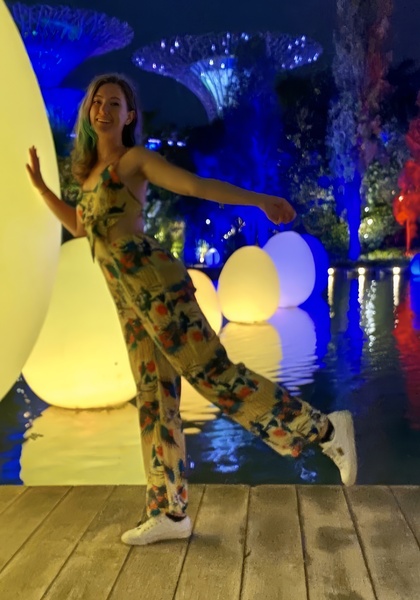 a woman in a floral jumpsuit