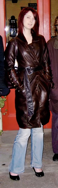 a woman in a brown leather jacket