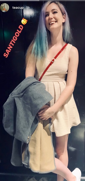 a woman with blue hair and a white dress