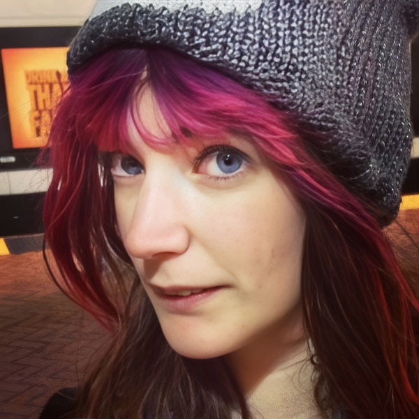 a woman with red hair and a hat