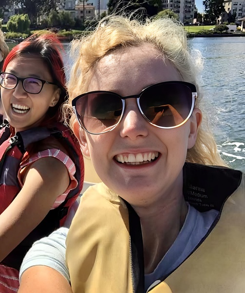 a woman and a young girl riding in a boat