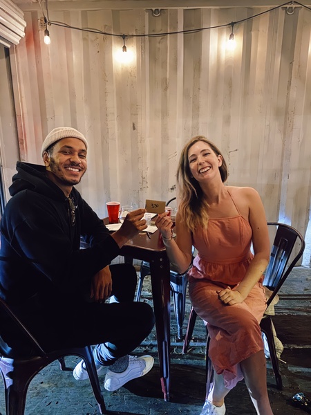 a man and woman sitting at a table Mt