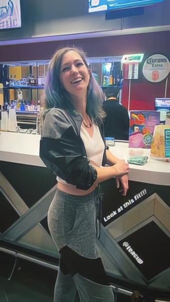 a woman standing in front of a counter