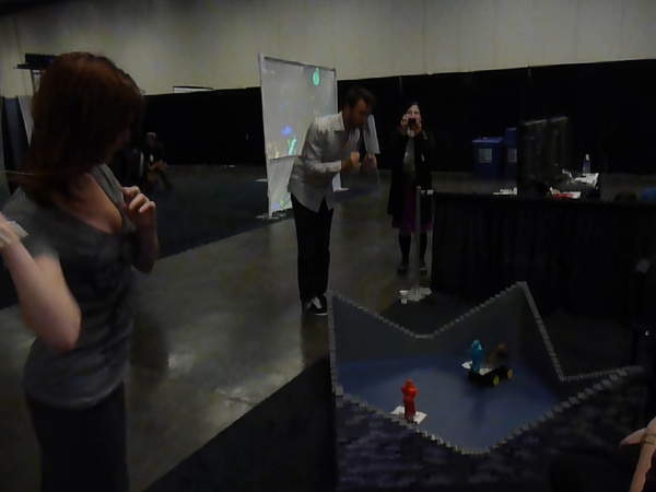 a woman is standing in a room with a project