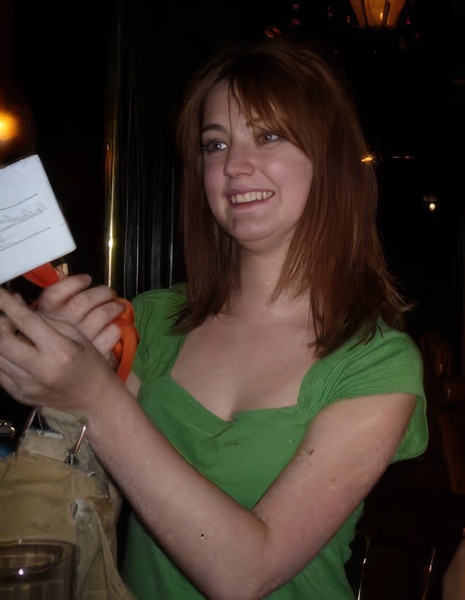 a woman holding a piece of paper in her hand