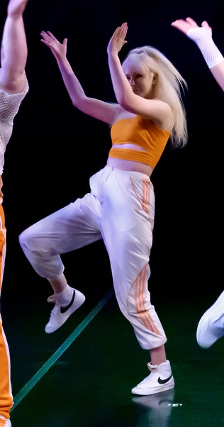 a group of young people in a dance pose