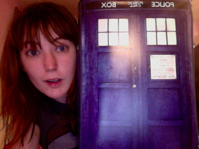 a woman holding a Tardis