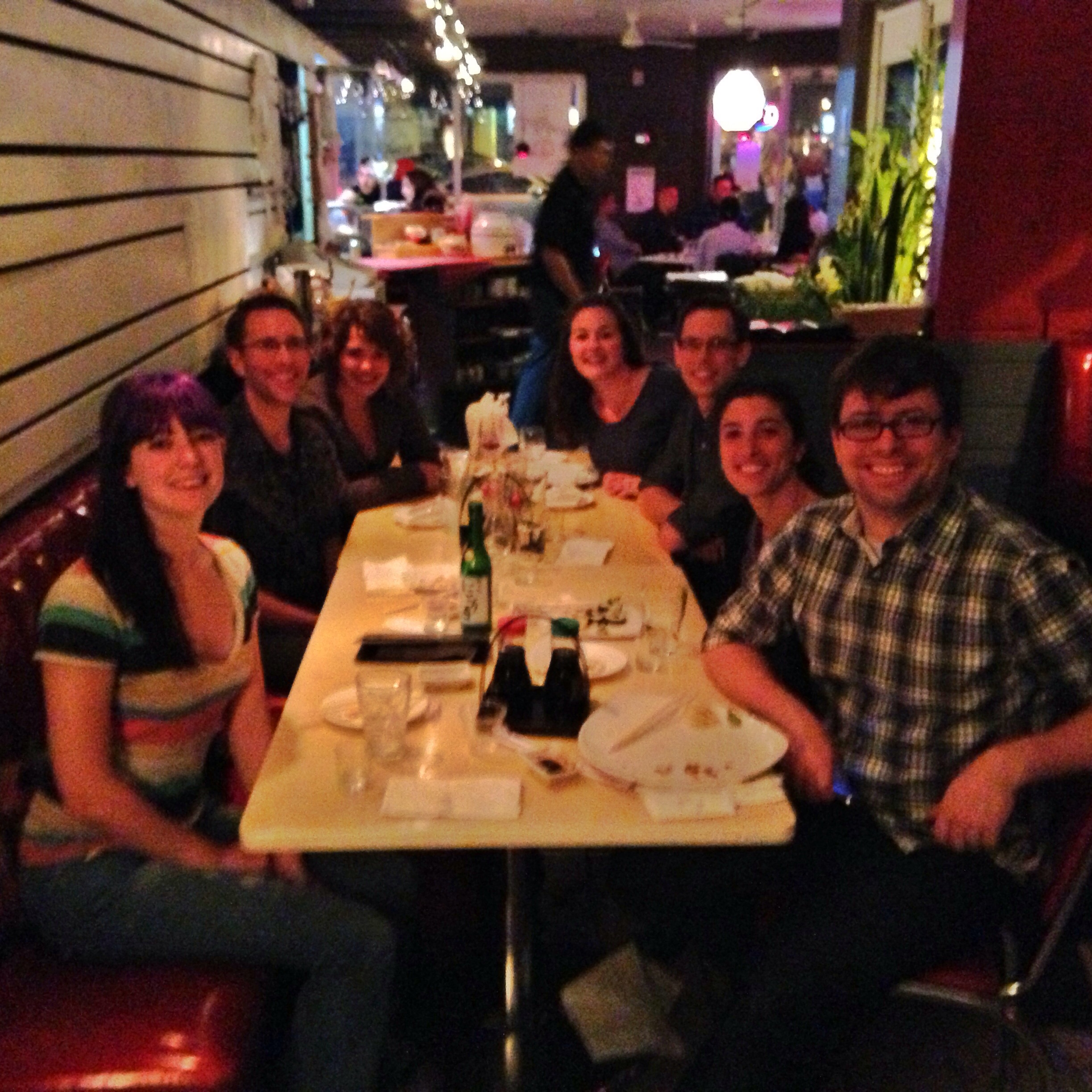 a group of people sitting at a table