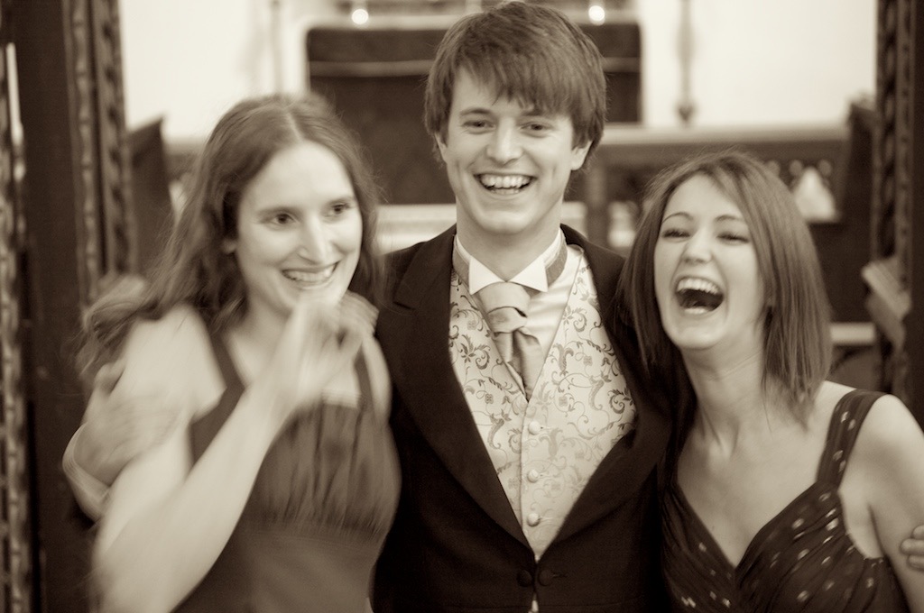 three young people are posing for a photo