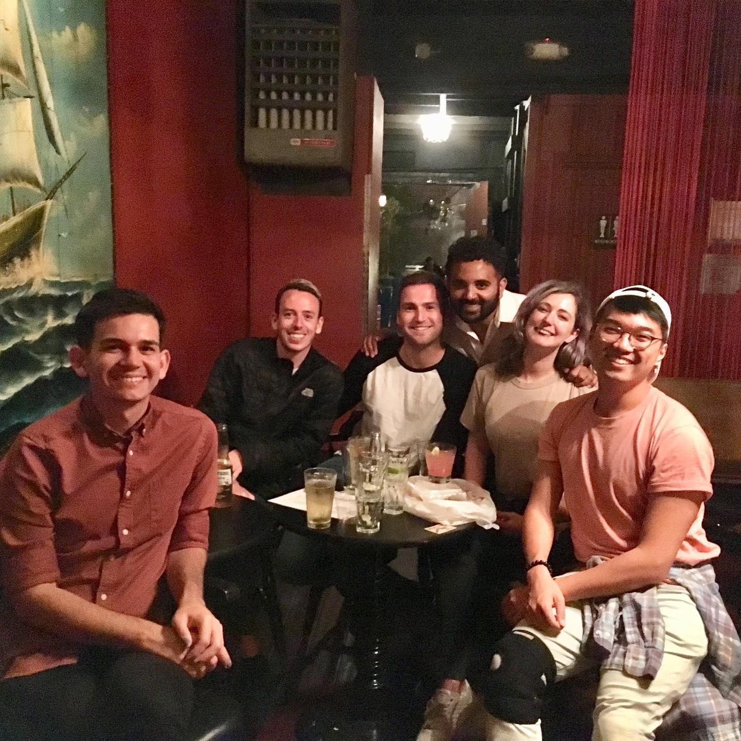 a group of people sitting around a table