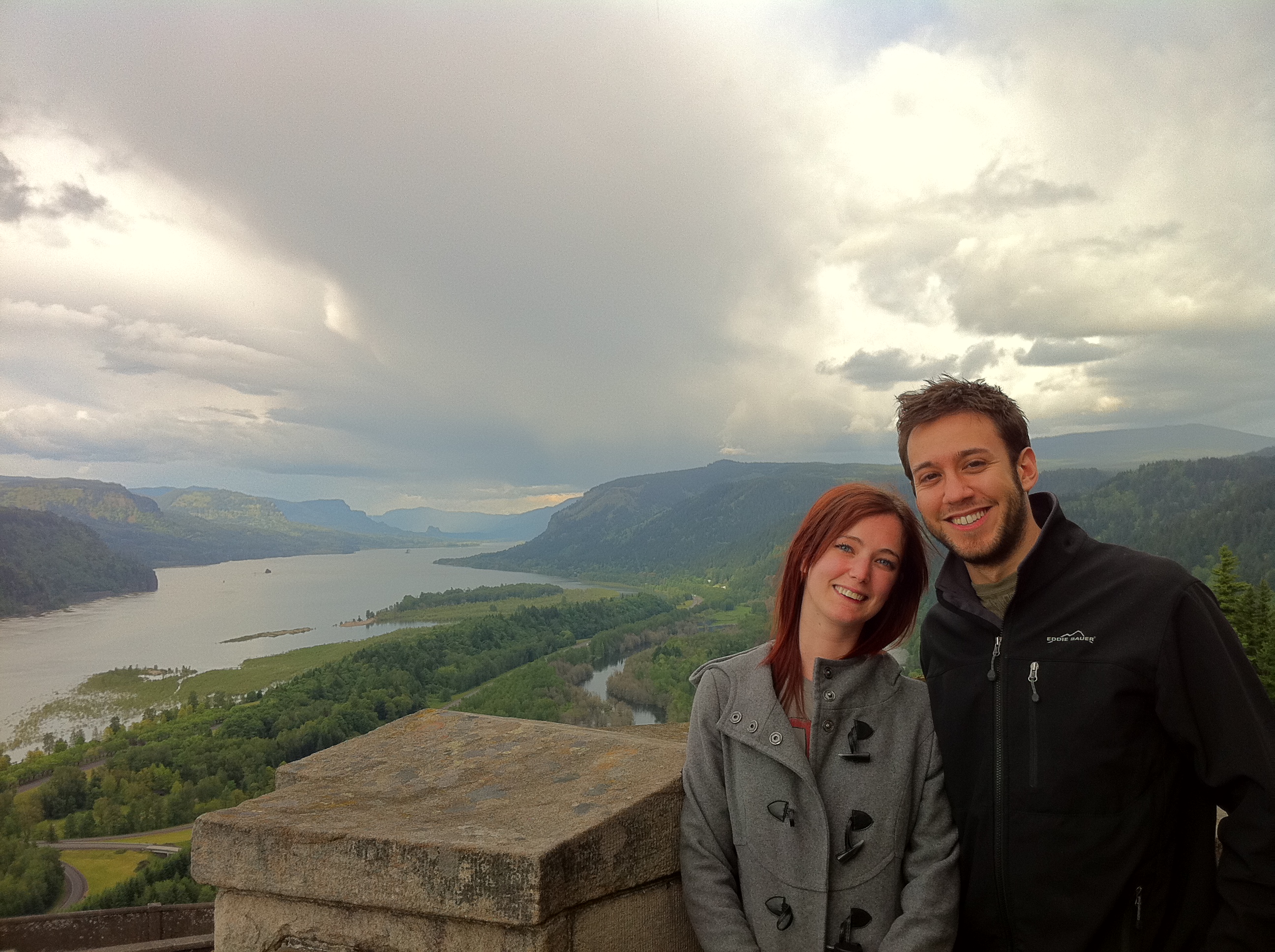 a man and woman are posing for a picture ¢
i

3
=
rl
5