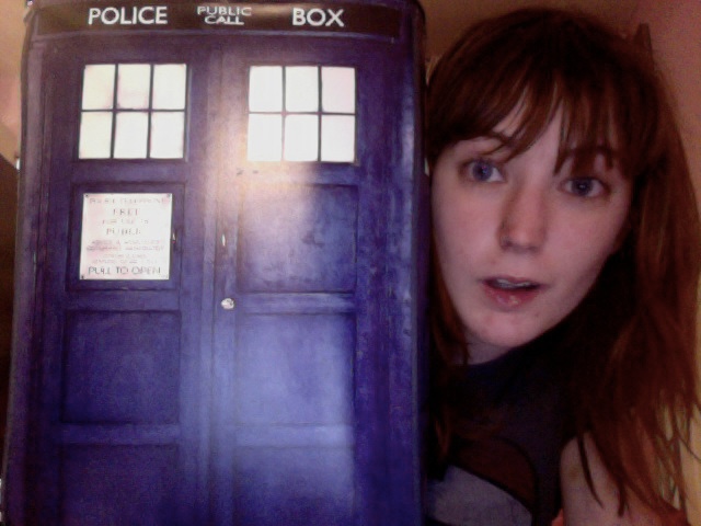 a woman holding a Tardis