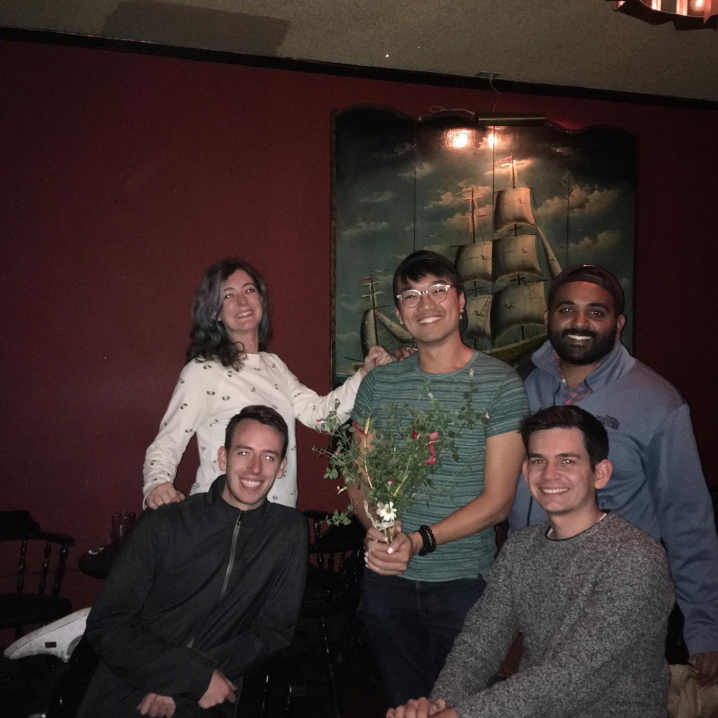 a group of people sitting around a table