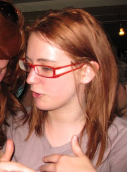 a woman wearing a red shirt