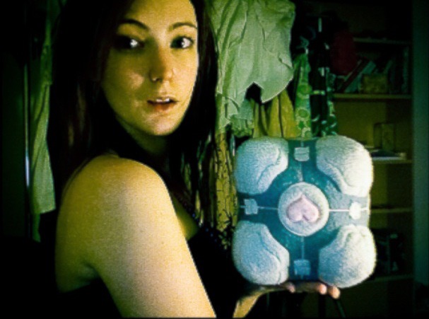 a woman holding a stuffed animal in her hands