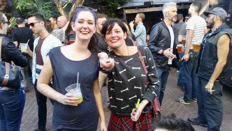 two women standing next to each other women