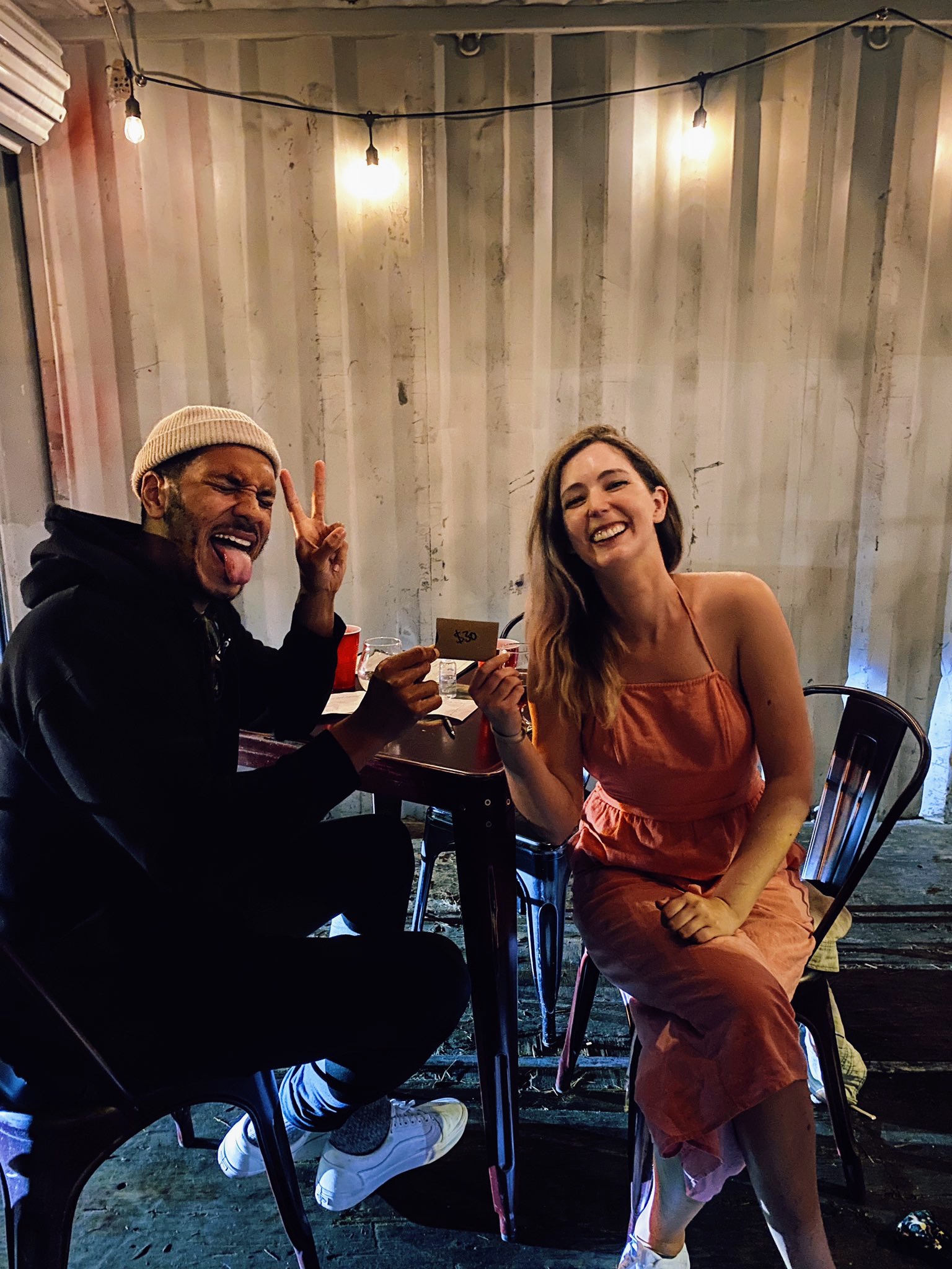 a man and woman sitting at a table