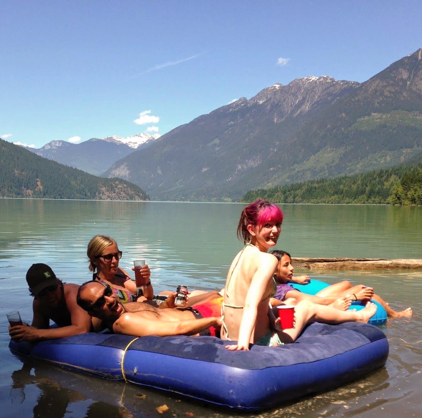 a group of people floating on a lake