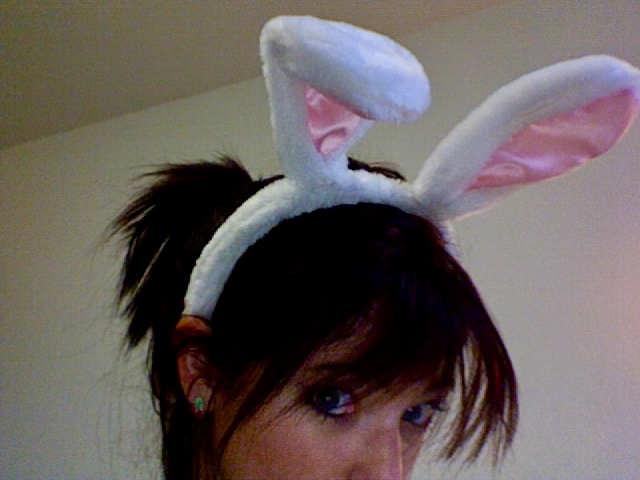 a woman wearing a bunny ears headband