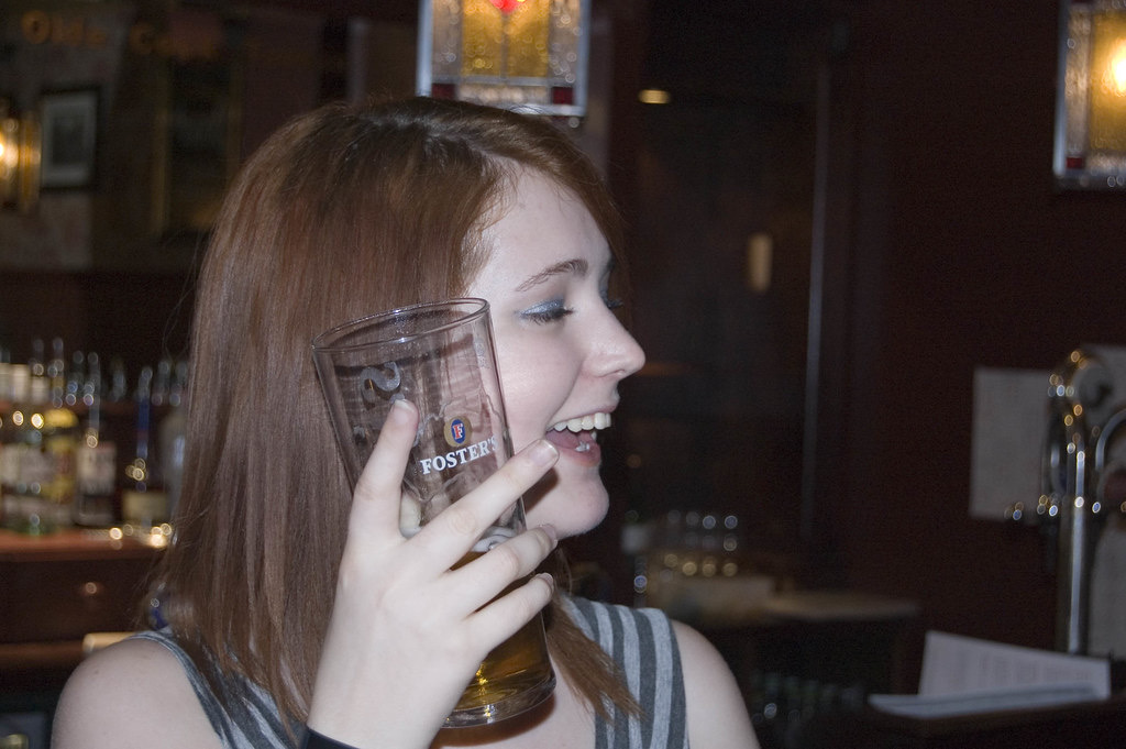 a woman talking on a cellphone phone