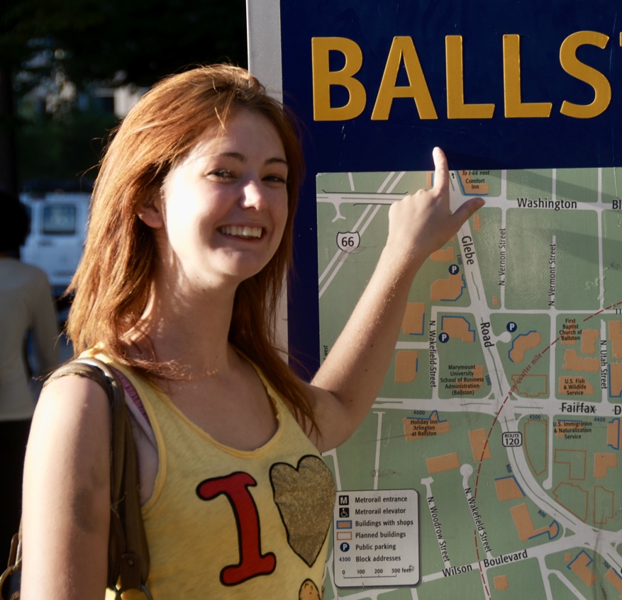 a woman points at a map of ballston