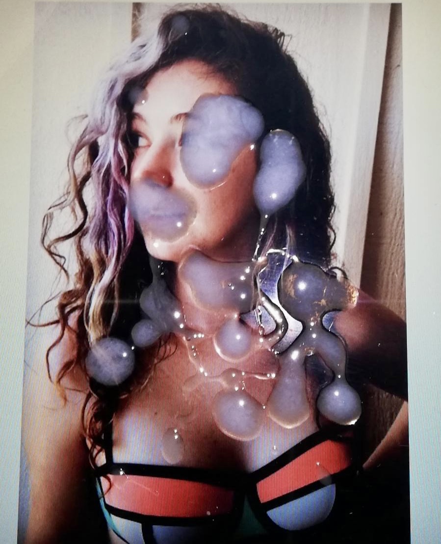 a woman with a bubble in her mouth