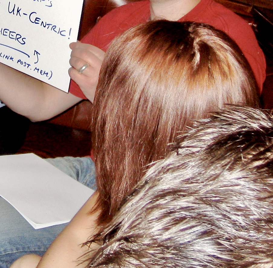 a woman holding a sign