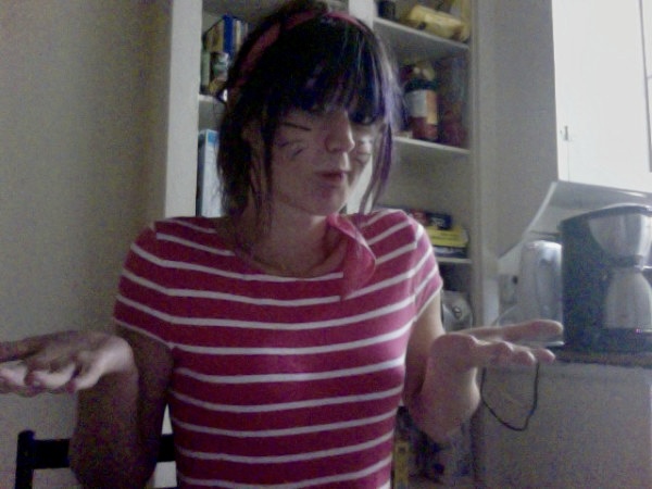 a woman in a red and white striped shirt