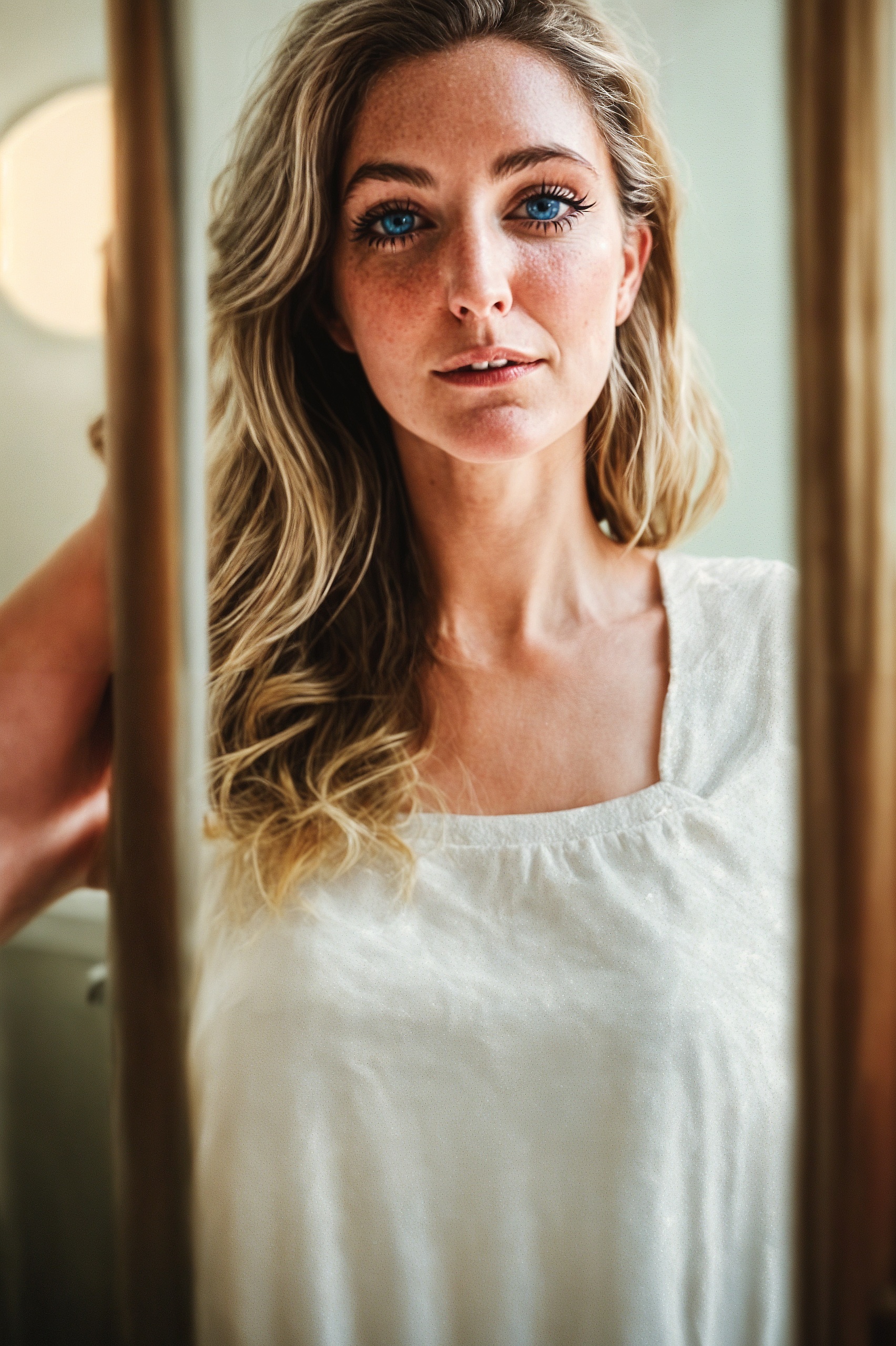 a woman with blue eyes looking into the camera