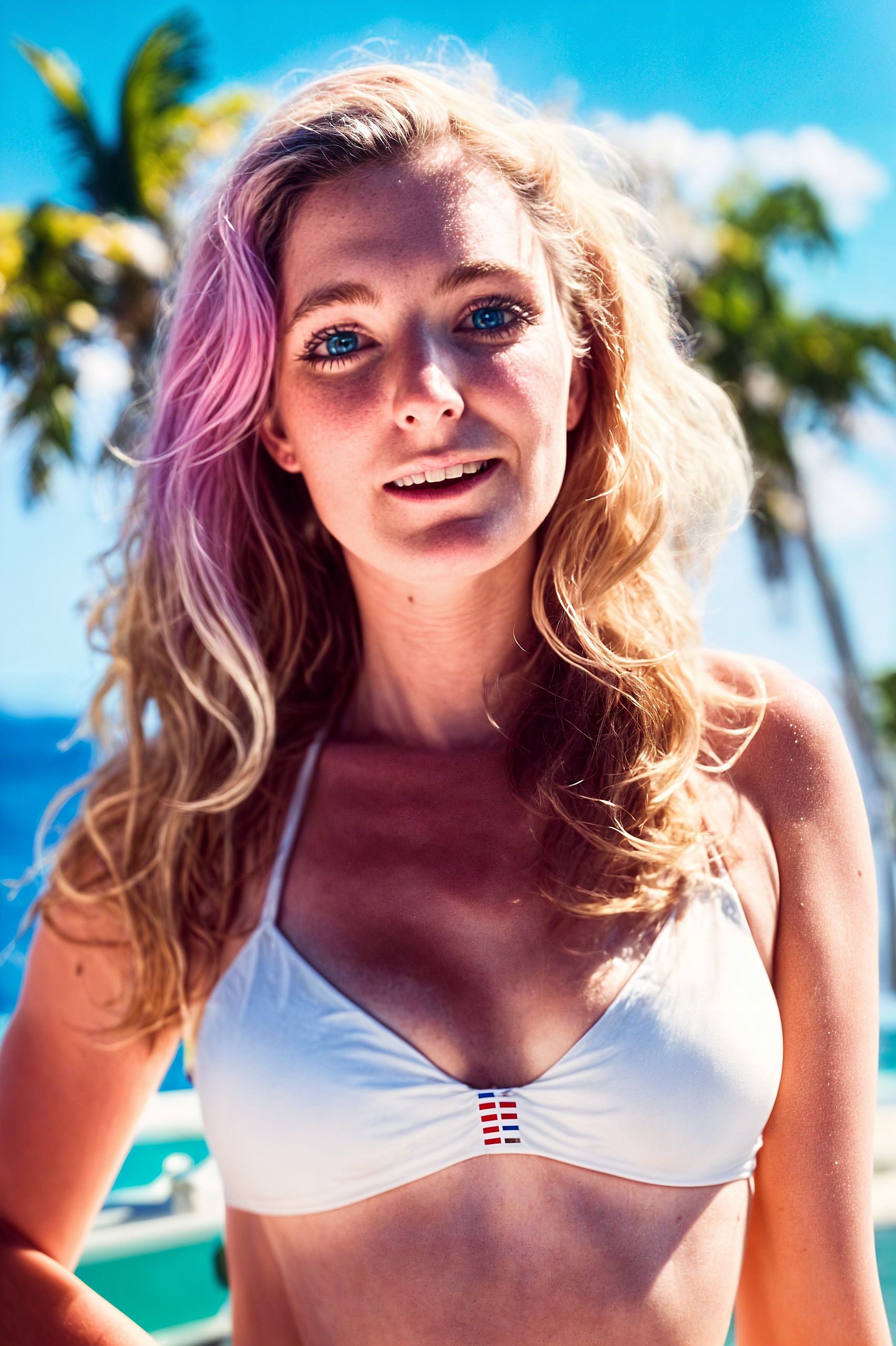 a woman in a bikini top on a beach