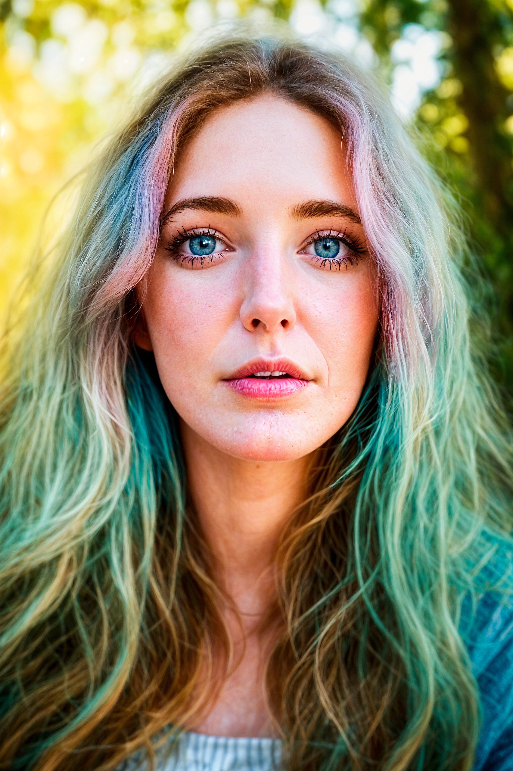 a woman with long blonde hair and blue eyes