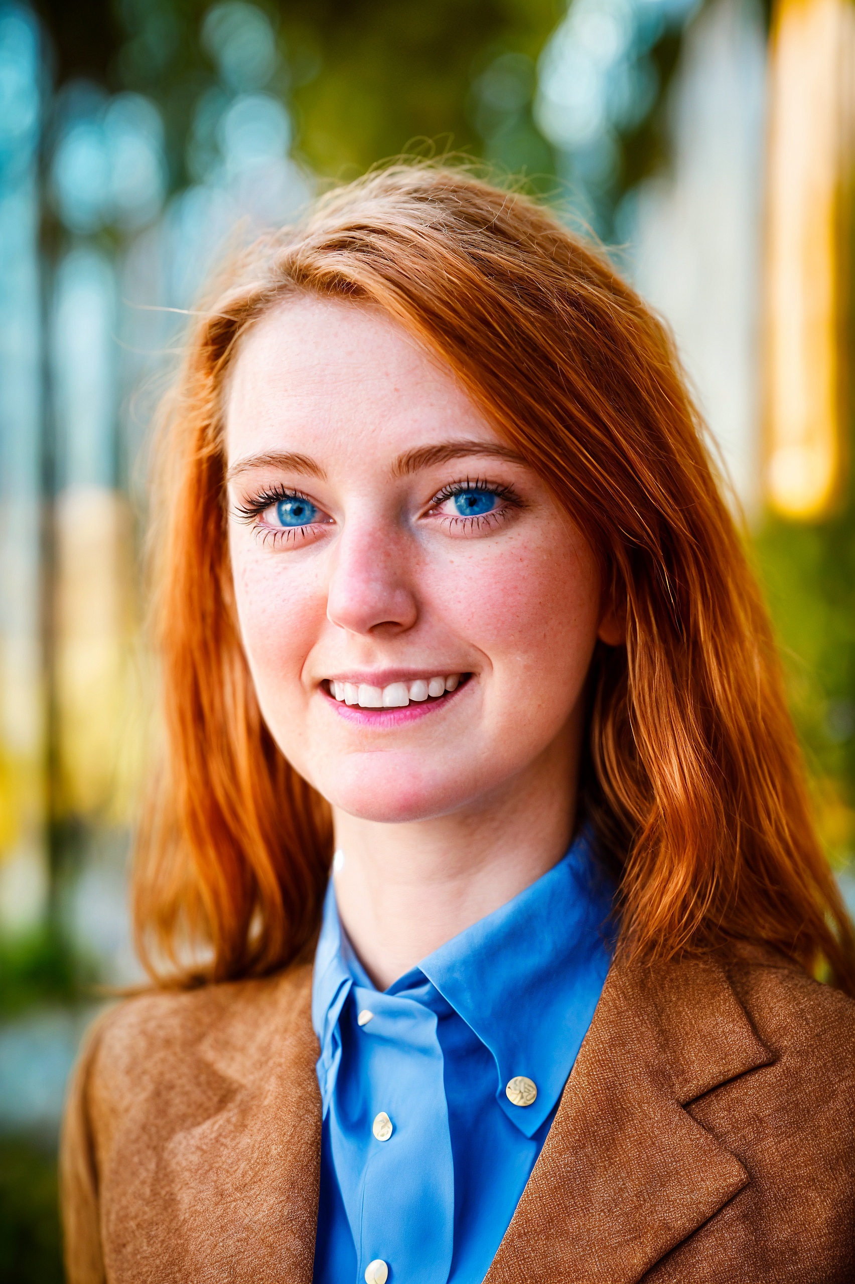 a woman with red hair and blue shirt