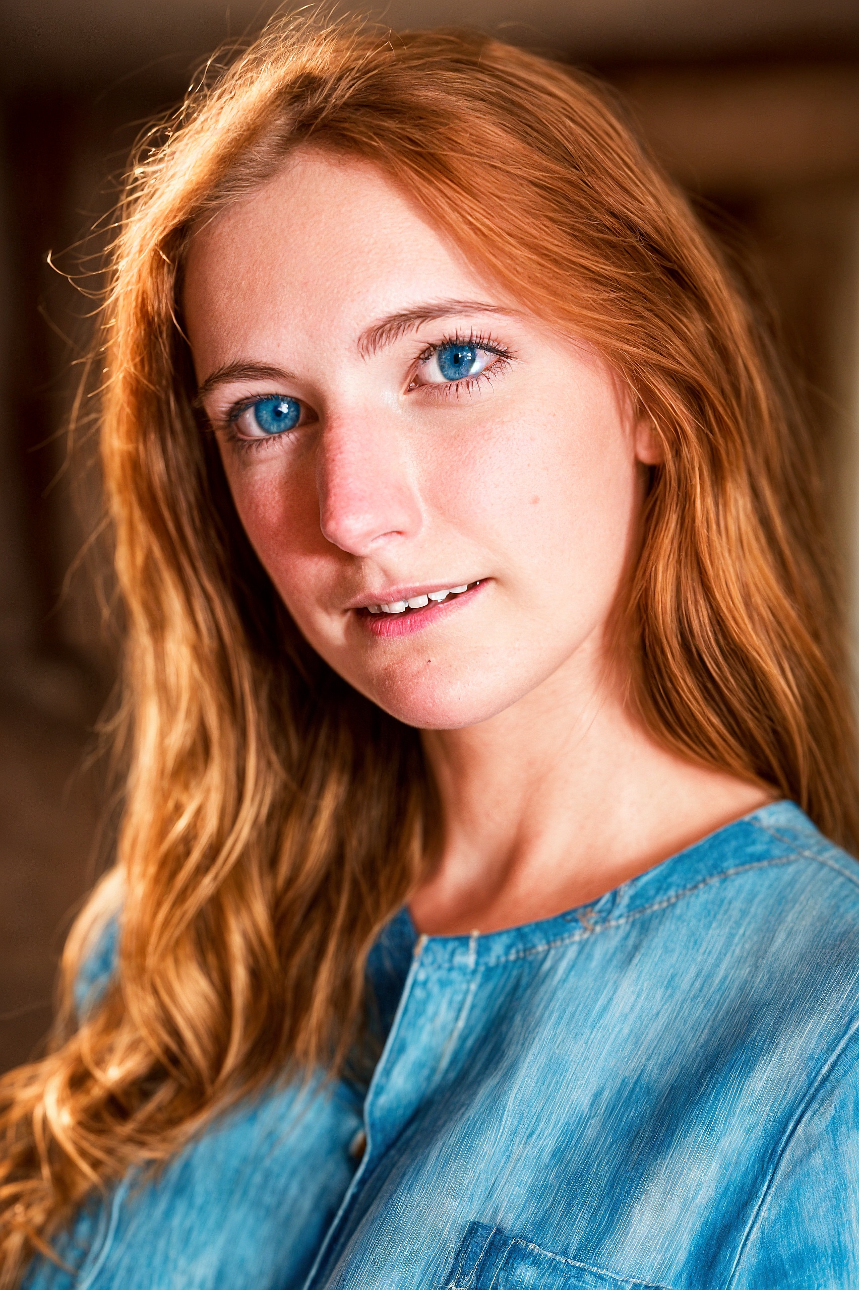 a woman with long hair and blue eyes