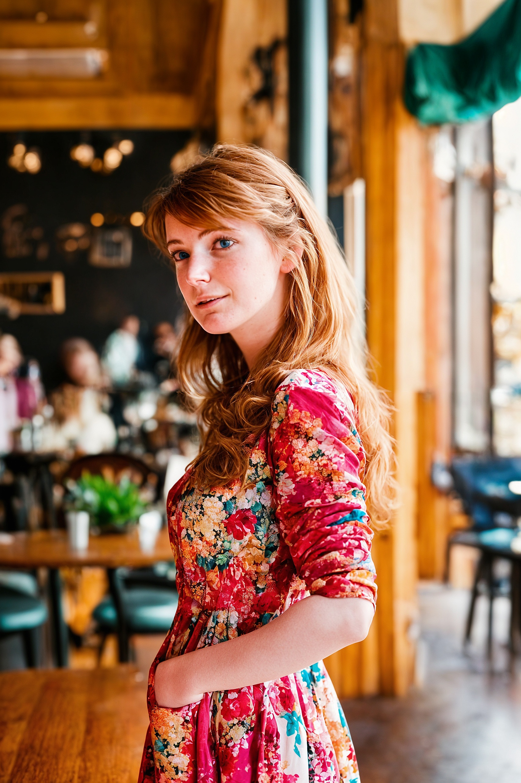 a woman standing in a restaurant